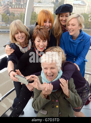 (from left) Rachel Johnson, Kathy Lette, Mary Portas, Julie Walters, Cathy Newman, Natascha McElhone and Stella Creasy MP pose for a selfie as they mentors girls from Dunraven School in Streatham on the London Eye as part of Southbank Centre's activities to mark the third UN International Day of the Girl, London. Stock Photo