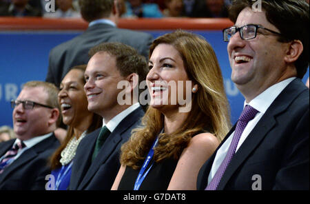 Conservative Party Chairman Grant Shapps (third left), Baroness Karren Brady (second right) and Conservative treasurer Lord Andrew Feldman (right) listen to Chancellor of the Exchequer George Osborne making his keynote address to the Conservative Party conference at the International Convention Centre in Birmingham. Stock Photo
