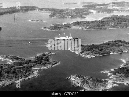 The Royal Yacht Britannia, carrying Queen Elizabeth II and Prince Philip, sails through the Aland Islands following their visit to Mariehamn, the day before they begin a four-day official visit to Finland. Stock Photo