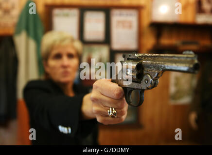 Curator Savina Donohoe holds a nickel plated revolver said to have been carried by Arthur Griffiths in the early days of the Civil War that has been quietly rediscovered after being hidden in an attic for decades, it has been claimed, now being held at Cavan County Museum in Ballyjamesduff. Stock Photo