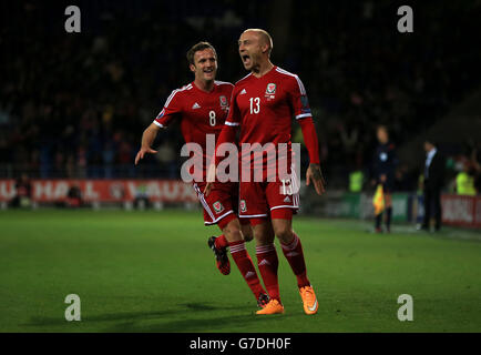 Wales' David Cotterill (right) celebrates scoring his sides first goal of the game during the UEFA Euro 2016 qualifying match at the Cardiff City Stadium, Cardiff. Stock Photo