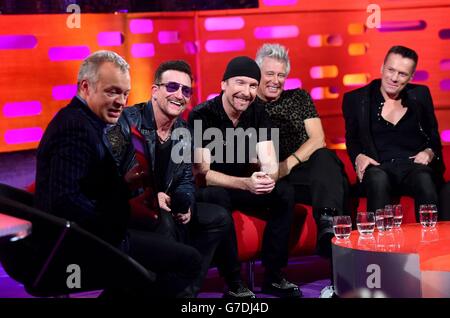 (left to right) Graham Norton, Bono, The Edge, Adam Clayton and Larry Mullen Jr during filming of the Graham Norton show, filmed at the London Studios, London, to be aired on BBC One on Friday evening. Stock Photo