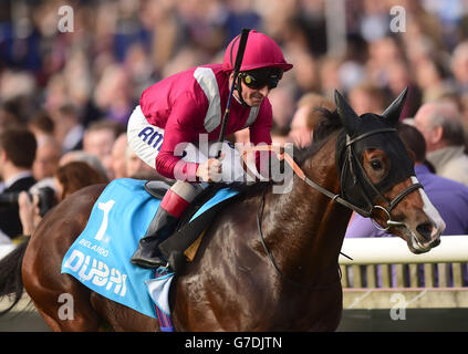 Horse Racing - Dubai Future Champions Day - Newmarket Racecourse. Belardo ridden by Andrea Atzeni wins the Dubai Dewhurst Stakes during Dubai Future Champions Day at Newmarket Racecourse. Stock Photo