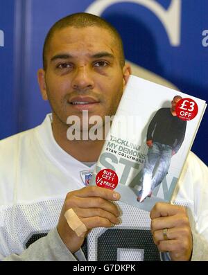 Stan Collymore signs copies of his book at WH Smith in The Trafford Centre, Manchester. The former footballer claimed that Zara Phillips tried to warn him away from a nightclub confrontation with a group of Bath rugby players in the Lillies Bordello club in Dublin, Sunday. Stock Photo