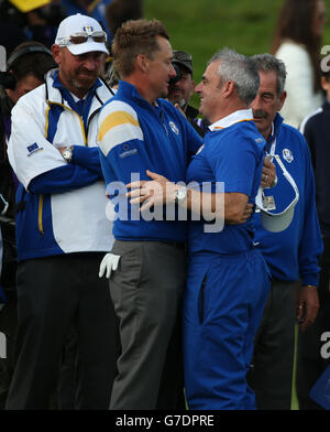 European captain Paul McGinley is congratulated by player Ian Poulter as they celebrate winning the 40th Ryder Cup at Gleneagles Golf Course, Perthshire. Stock Photo