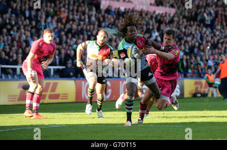 Harlequins' Marland Yarde hands off London Welsh's Rob Lewis to run in and score his second and his side's seventh try during the Aviva Premiership match at Twickenham Stoop, London. PRESS ASSOCIATION Photo. Picture date: Saturday October 4, 2014, See PA story RUGBYU Harlequins. Photo credit should read: Andrew Matthews/PA Wire. RESTRICTIONS: Use subject to restrictions. No commercial use.