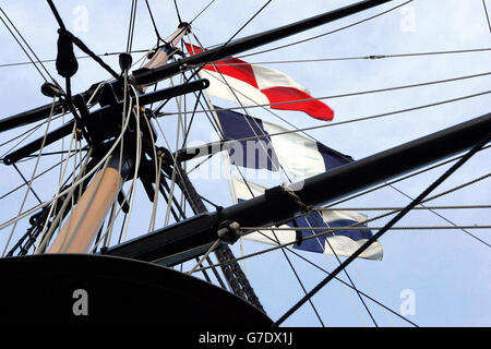 Nelson's naval signal 'England expects that every man will do his duty' is raised on the HMS Victory at Portsmouth Naval Base to mark the 199th anniversary of Admiral Lord Nelson's triumph at the Battle of Trafalgar. The central act of the commemoration was the laying of a laurel wreath by Second Sea Lord Vice Admiral Sir James Burnell-Nugent on the spot where Admiral Nelson fell when he was shot in battle. Stock Photo