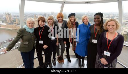 (from left) Julie Walters, Kathy Lette, Rachel Johnson, Mary Portas, Natascha McElhone, Stella Creasy MP, Christine Ohuruogo and Cathy Newman pose as they mentors girls from Dunraven School in Streatham on the London Eye as part of Southbank Centre's activities to mark the third UN International Day of the Girl, London. Stock Photo