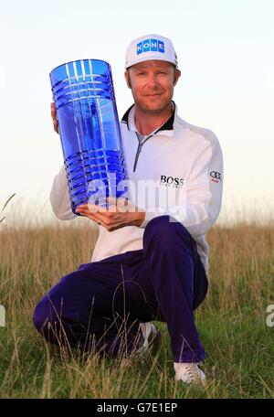 Finland's Mikko Ilonen holds the winners trophy after winning the World Match Play Championship after victory in the final match against Henrik Stenson at The London Golf Club, Kent. Stock Photo