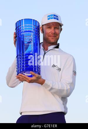 Finland's Mikko Ilonen holds the winners trophy after winning the World Match Play Championship after victory in the final match against Henrik Stenson at The London Golf Club, Kent. Stock Photo