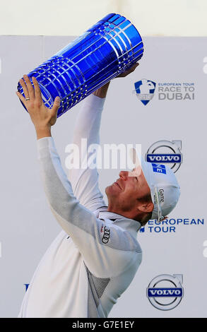 Finland's Mikko Ilonen holds the winners trophy after winning the World Match Play Championship after victory in the final match against Henrik Stenson at The London Golf Club, Kent. Stock Photo