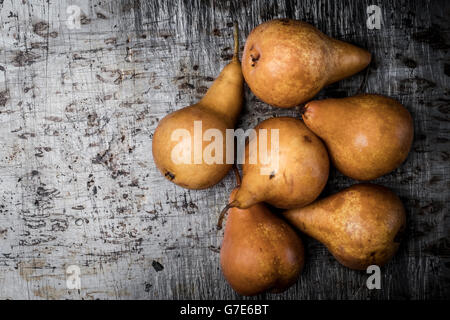 Fresh pears on metal texture background. Free space for text . Stock Photo