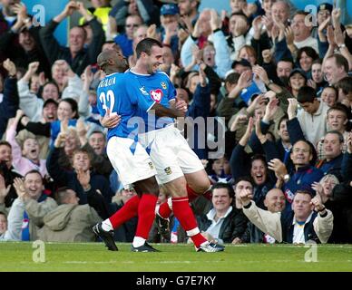 Portsmouth's David Unsworth celebrates his goal against Manchester United with Lomana Lualua during the Barclays Premiership match at Fratton Park, Portsmouth, Saturday October 30, 2004. Stock Photo