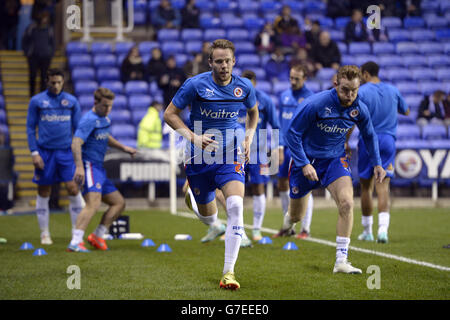 Reading's Chris Gunter (centre) warms up before the Sky Bet Championship match at the Madejski Stadium, Reading. PRESS ASSOCIATION Photo. Picture date: Tuesday November 4, 2014. See PA story SOCCER Reading. Photo credit should read Andrew Matthews/PA Wire. Maximum 45 images during a match. No video emulation or promotion as 'live'. No use in games, competitions, merchandise, betting or single club/player services. No use with unofficial audio, video, data, fixtures or club/league logos. Stock Photo