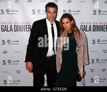 Robin Van Persie and wife Bouchra Van Persie arrive at the United for UNICEF Gala Dinner attended by the Manchester United first-team and VIP guests at Old Trafford, Manchester. Stock Photo