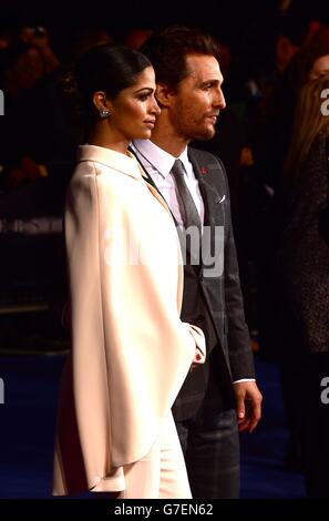 Matthew McConaughey and Camila Alves arriving at Odeon Leicester Square in central London for the European premiere of the film, Interstellar. Stock Photo