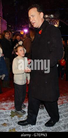 Actor Tom Hanks greets a young fan as he arrives for the UK premiere of his latest film The Polar Express, at the Vue Leicester Square in central London. Stock Photo