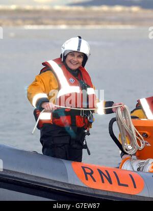 RNLI Lifeboat woman Aileen Jones on board a lifeboat at Porthcawl, South Wales, who is to become the first female in 116 years to receive a bravery award. Aileen, helmsman of the RNLI's Porthcawl lifeboat led a team who braved gale force winds and rough sees in August to save a skipper and injured fisherman. Stock Photo