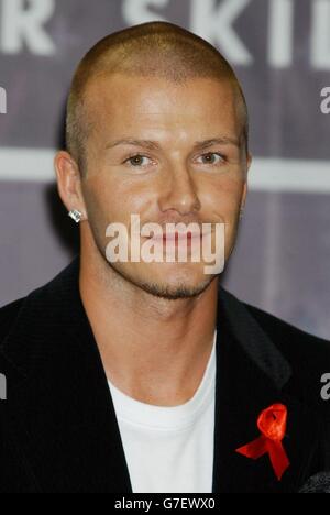 David Beckham poses for photographers during an in-store appearance at Virgin Megastore on Oxford Street, central London, to sign copies of his official training skills DVD, 'Really Bend It Like Beckham'. Stock Photo