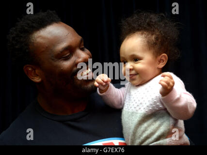 Boxing - Dereck Chisora Media Work Out - Malmaison Hotel. Dereck Chisora with his six month old daughter Angie during a Press Conference at the Malmaison Hotel, London. Stock Photo