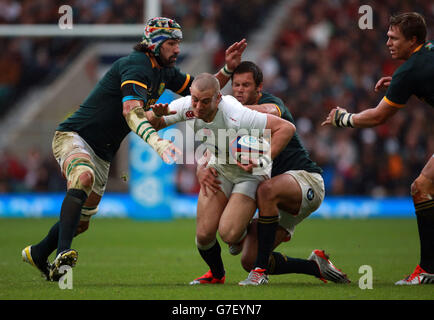 Rugby Union - QBE International 2014 - England v South Africa - Twickenham. England's Mike Brown is tackled by South Africa's Victor Matfield (left) during the QBE International at Twickenham, London. Stock Photo