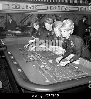 Croupiers at the dice table on the opening night of the Maverick Club in Peckham High Street, which is modelled on an American mid-West gambling saloon of the last century. (l-r) Pat Andrew, of London, Susan Dorrington, of Rochester, Penny Slade, of London, and Shirley Brewin, of St Mary Cray. Stock Photo