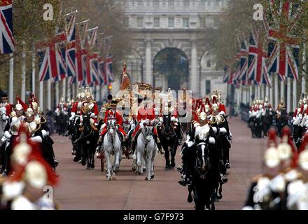 Britain's Queen Elizabeth II, accompanied by the Duke of Edinburgh return from the House of Lords in a horse-drawn carriage to Buckingham Palace, London, following the State Opening of Parliament. The Queen delivered her speech in which security was a key theme, as a showcase to the lead-up of the General elections in May. Stock Photo