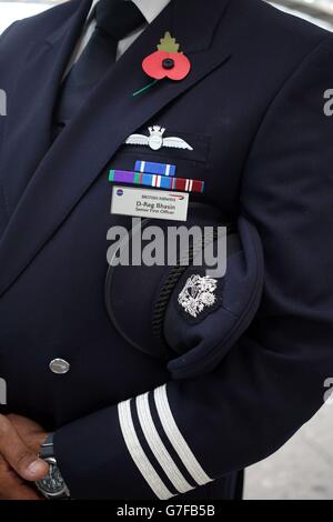 British Airways 787 Senior First Officer Dheeraj Bhasin wearing military honours for services for NATO in former Yugoslavia and General Service Medal for Air operations in Iraq after he took part in the two minutes silence for Armistice Day. Stock Photo
