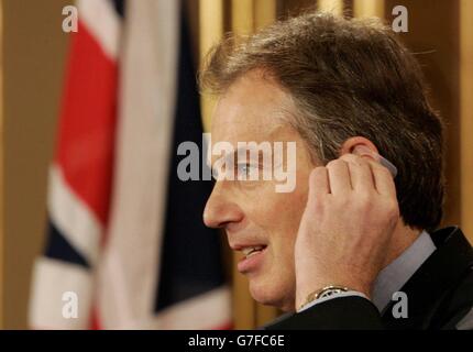 Britain's Prime Minister Tony Blair listens to South Korea's President Roh Moo-Hyun (unseen) during a news conference in London. Stock Photo