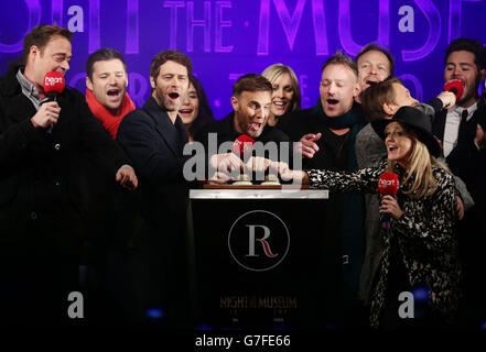 Heart London presenters Jamie Theakston (left) and Emma Bunton (front right) host Night At The Museum: Secret Of The Tomb as the theme to the Regent Street Christmas lights in central London, with Gary Barlow (centre), Howard Donald (third left) and Mark Owen (second right) of Take That flicking the switch, joined by Toby Anstis (third right) Jenni Falconer (back centre), next to Jason Donovan (back) at the annual attraction. Stock Photo