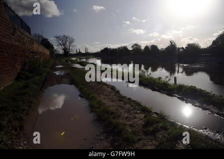 Flood defences remain in the village of Burrowbridge in Somerset, as fears of flooding have hit parts of Britain after a number of weather warnings for wind and rain. Stock Photo