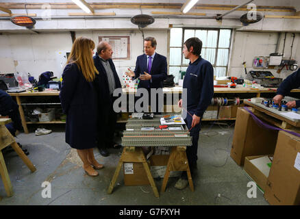 Prime Minister David Cameron (centre) with Kelly Tolhurst (left) Conservative Candidate for Rochester and Strood, talking to members of staff at MCL Mechanical near Rochester, Kent, ahead of the forthcoming by-election later this week. Stock Photo