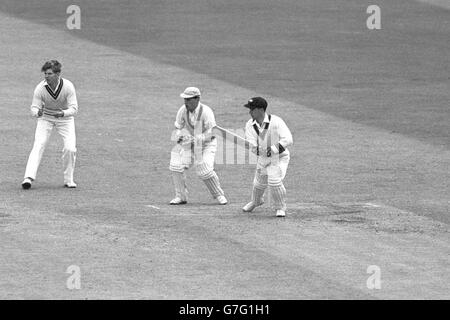 Australia's Ian Craig in batting action against Cambridge University. Keeping wicket for Cambridge is Michael Melluish. Stock Photo