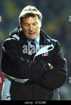 Wolverhampton Wanderers new manager Glenn Hoddle watches his team in action during the Coca-Cola Championship match against Watford at Vicarage Road, Watford, Saturday December 11, 2004. . Stock Photo