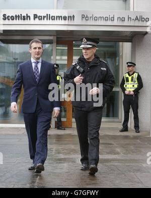 Justice Secretary Michael Matheson and Chief Constable of Police Scotland Sir Stephen House outside the Scottish Parliament in Edinburgh as recorded crime across Scotland hits a 40-year low. Stock Photo