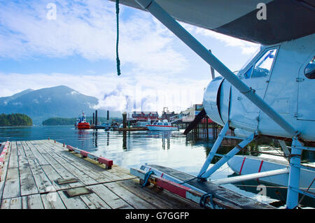 de Havilland Canada DHC-2 Beaver Float plane, operated by Tofino Air, moored in Tofino Harbor and looking over the town and bay. Stock Photo