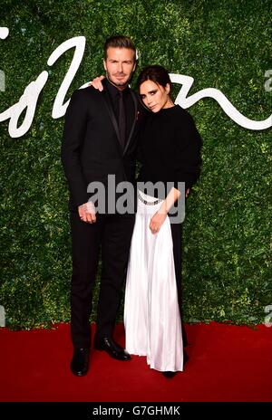 David Beckham and Victoria Beckham arriving for the 2014 British Fashion Awards, at The London Coliseum, St Martin Stock Photo