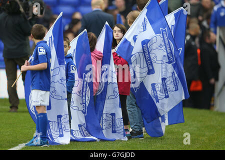 Soccer - Sky Bet Championship - Birmingham City v Nottingham Forest - St. Andrews. The Birmingham City match day mascots hold the club flags before the game. Stock Photo