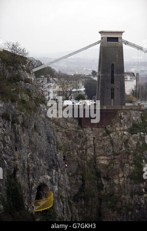 An Avon and Somerset Search and Rescue team abseil beside the Clifton Suspension Bridge as they work with police to search an area near Avon Gorge in Bristol, after the body of a woman was found last night.