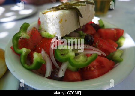 Greek salad, with Feta cheese, shot in a Greek taverna. Stock Photo