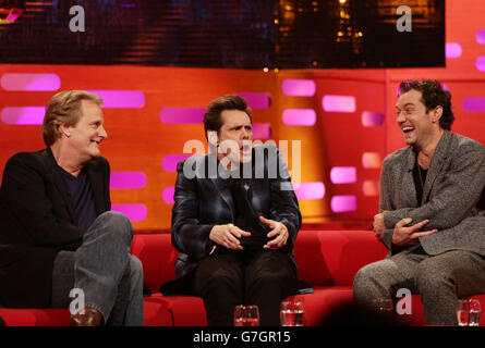 Guests (left to right) Jeff Daniels, Jim Carrey and Jude Law during filming of the Graham Norton Show at the London Studios, south London. Stock Photo