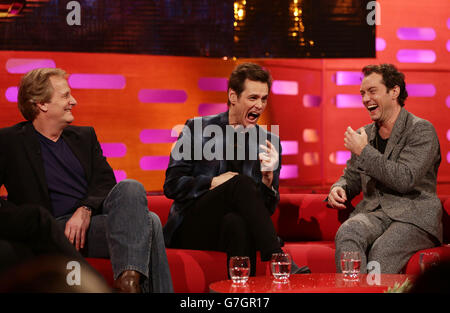 Guests (left to right) Jeff Daniels, Jim Carrey and Jude Law during filming of the Graham Norton Show at the London Studios, south London. Stock Photo