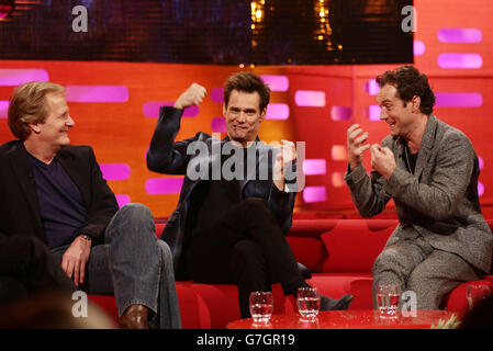 Guests (left to right) Jeff Daniels, Jim Carrey and Jude Law during filming of the Graham Norton Show at the London Studios, south London. Stock Photo