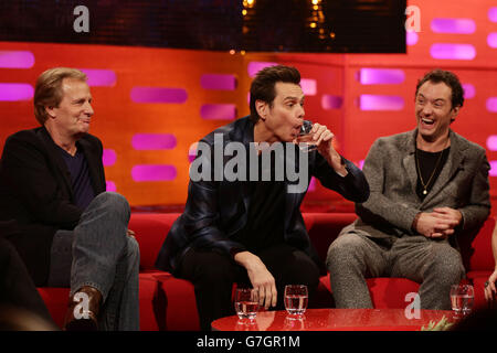 Guests (left to right) Jeff Daniels, Jim Carrey and Jude Law during filming of the Graham Norton Show at the London Studios, south London. Stock Photo