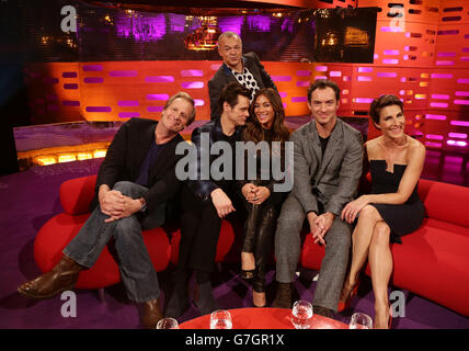 The host (top) with guests (left to right) Jeff Daniels, Jim Carrey, Nicole Scherzinger, Jude Law and Tamsin Greig during filming of the Graham Norton Show at the London Studios, south London. Stock Photo