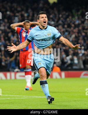 Manchester City's Sergio Aguero celebrates scoring his sides third goal of the game against Bayern Munich, during the UEFA Champions League match at the Etihad Stadium, Manchester. Stock Photo