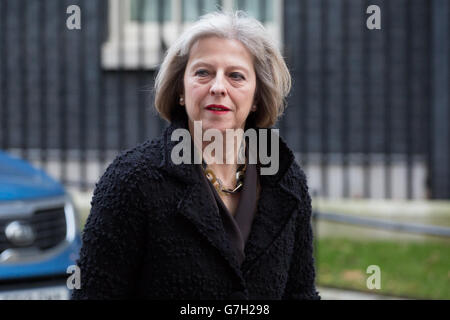 Home Secretary Theresa May leaves No 10 Downing Street in London, ahead of the Chancellor of the Exchequer George Osborne's Autumn Statement to MPs in the House of Commons. Stock Photo