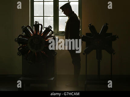 Gordon Corbet, a member of the Great War Society, looking a the Le Rhone Type 9C, 80hp air-cooled rotary engine, during a preview of the Royal Air Force Museum's The First World War in the Air exhibition, at the Royal Air Force Museum in London. Stock Photo