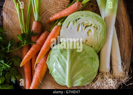 fresh organic vegetables on a wooden board Stock Photo