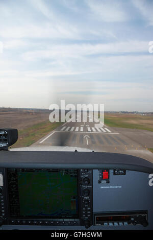 Kiev, Ukraine - November 12, 2010: View from the Cessna 172 Skyhawk cockpit while landing on the airport runway Stock Photo